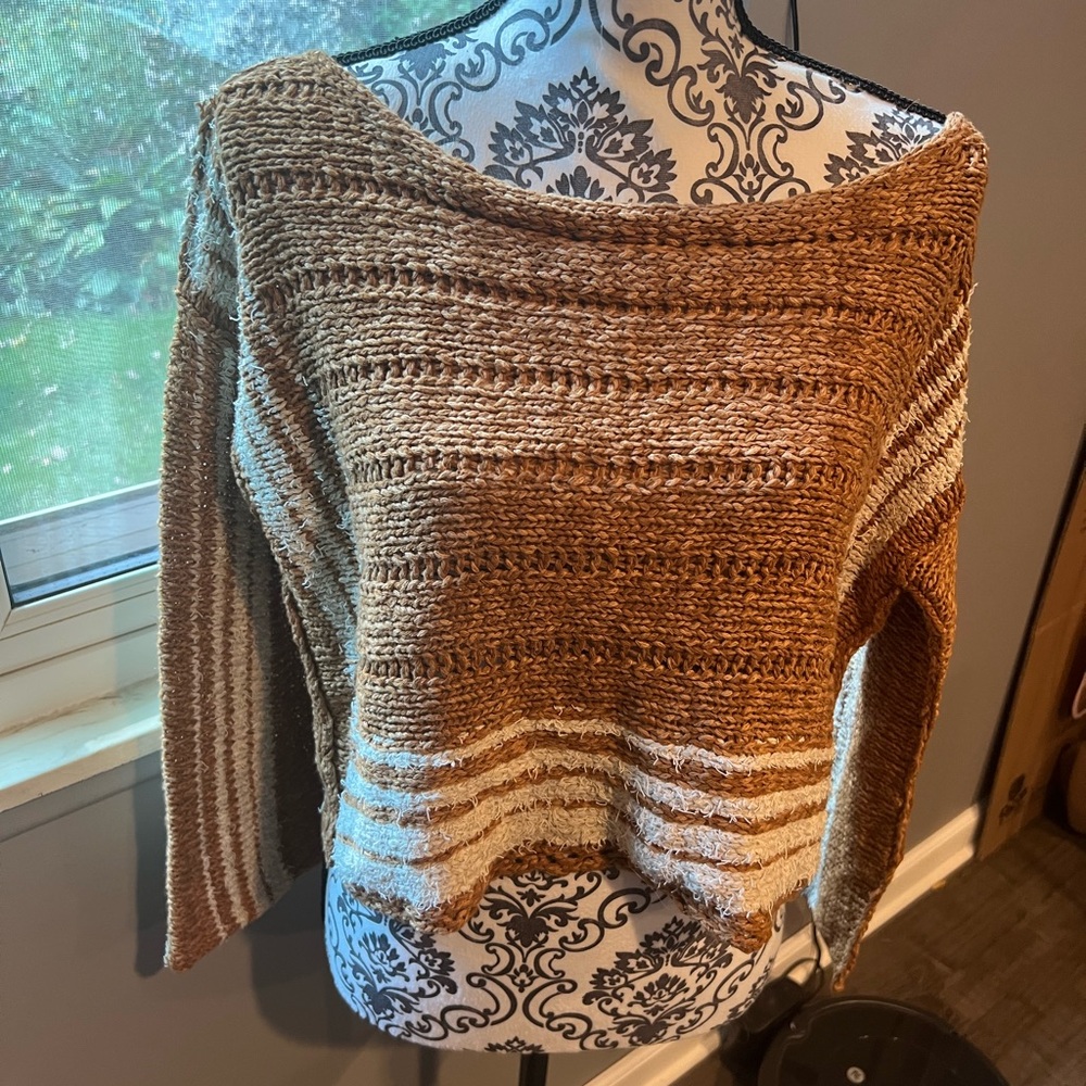 Free People Tan and Cream Off-the-Shoulder cropped Sweater.